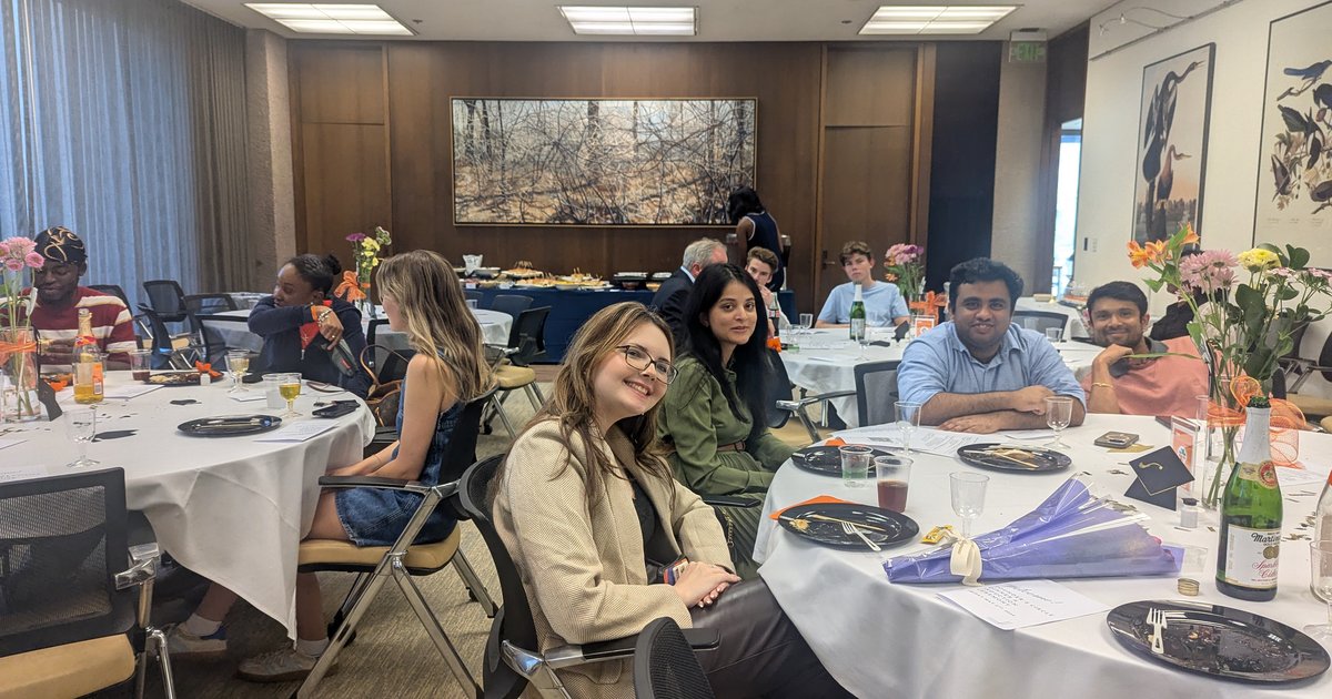 students sitting at tables as part of Founders Circle dinner
