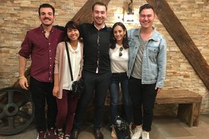 5 people pose for a group photo