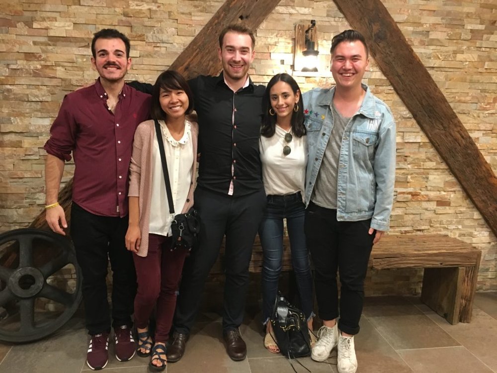 5 people pose for a group photo