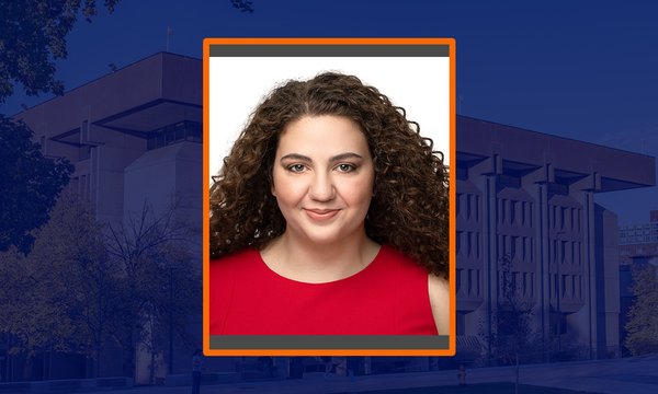 headshot of woman with blue sepia of Bird Library in background