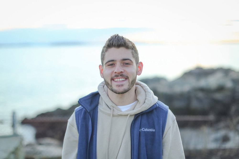 person standing in front of body of water