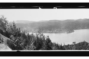 black and white photo of Adirondack Mountains and lake