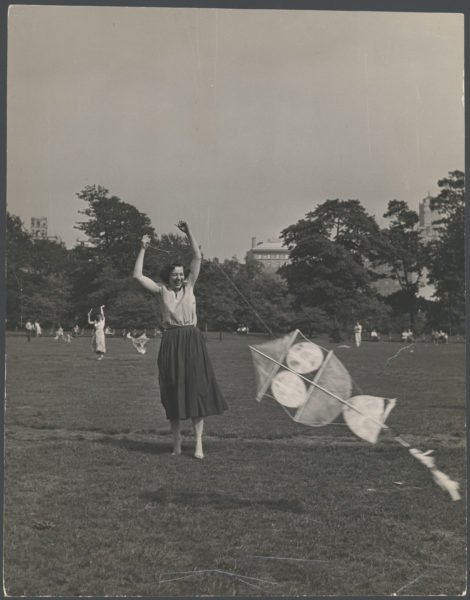 Woman laughing with kite
