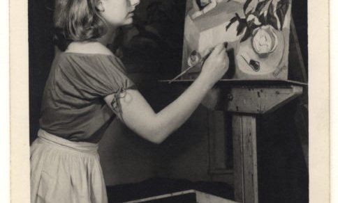 Woman painting on canvas