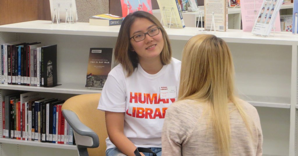 two people sitting in the library