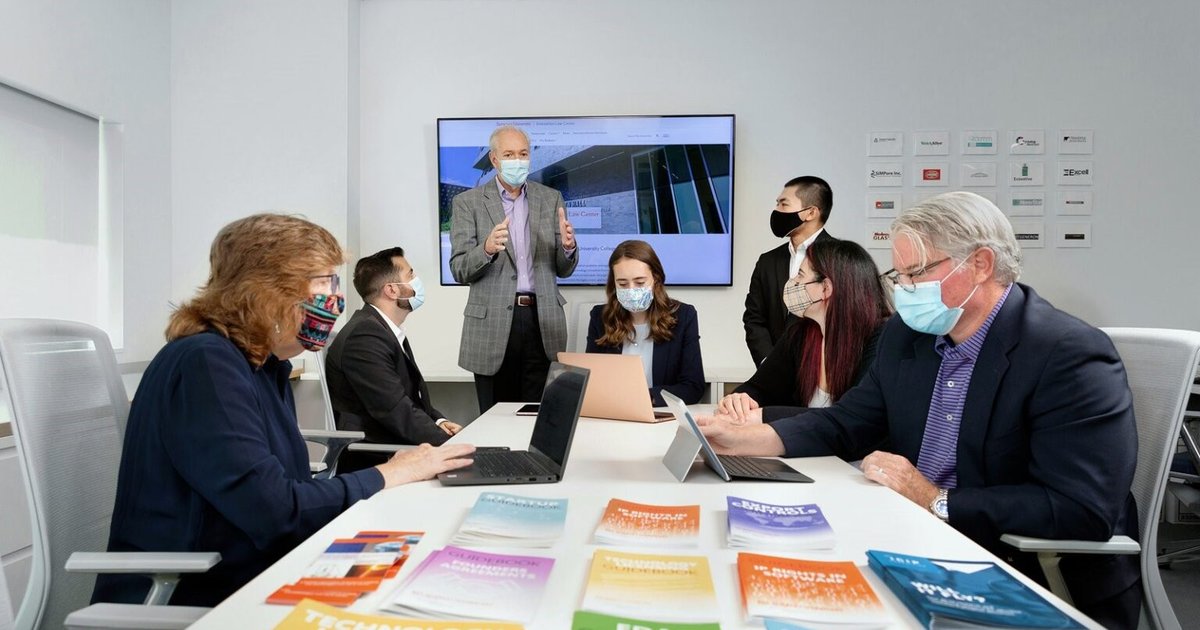 People discussing in the Innovation Law Center