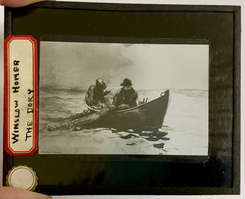 two people in small row boat in water
