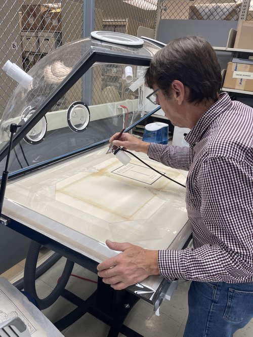 David Stokoe repairing book