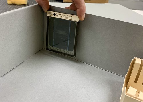 glass plate negative being held in gray box
