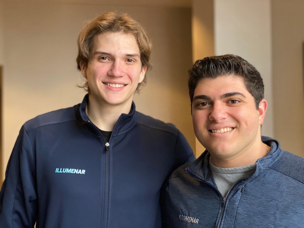 two young men wearing jackets with Illumenar name