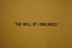 Yellow background with words "Well of Loneliness" in black