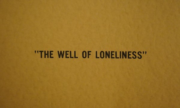 Yellow background with words "Well of Loneliness" in black