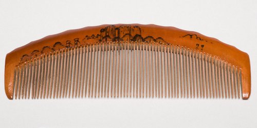 In the 18th and 19th centuries, wooden combs were not as common as those made of other materials such as ivory, horn, and tortoise shell, but many examples from this era do survive. This particular example is undated.