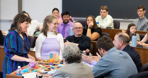 Students presenting ideas in design competition as part of Intelligence++ program.