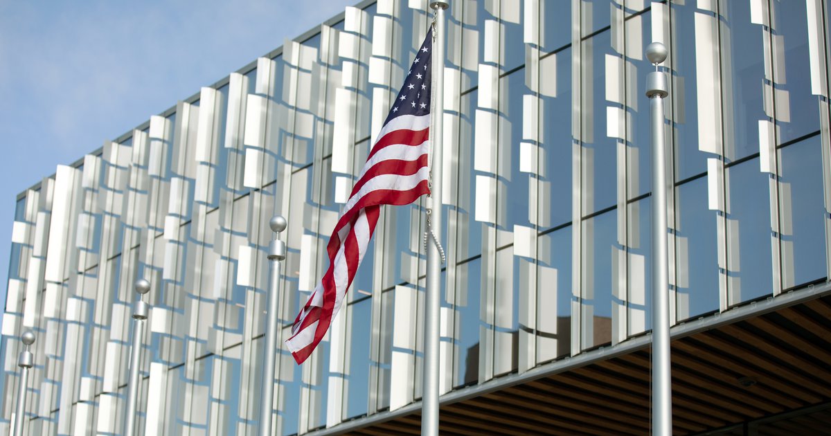 American flag flying in front of National Veterans Resource Center at Syracuse University