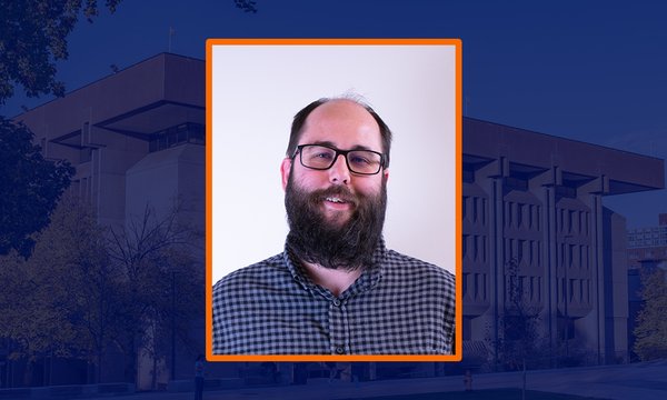 headshot with blue sepia image of Bird Library in background