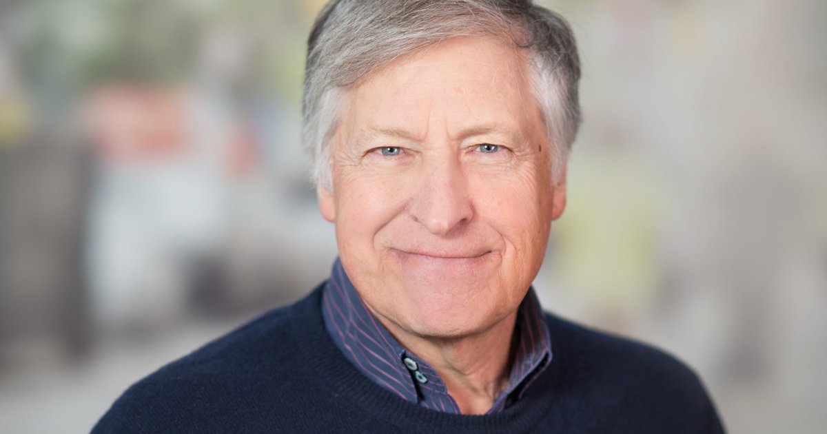 Man in a sweater smiling