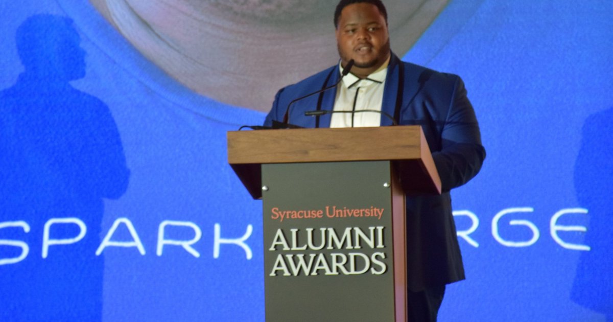 Josh Aviv at the podium