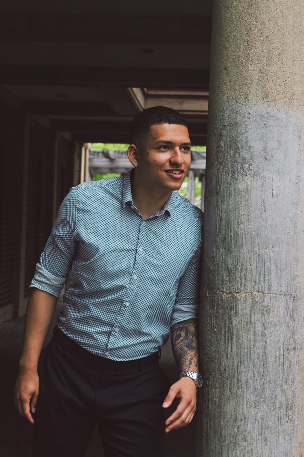 person leaning against concrete wall