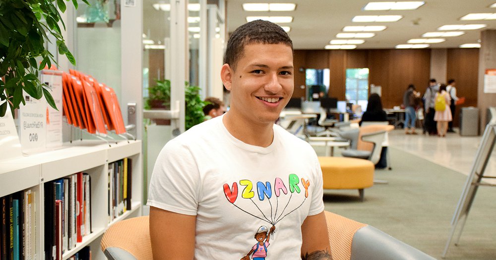 Justin Diaz sitting in front of Blackstone LaunchPad