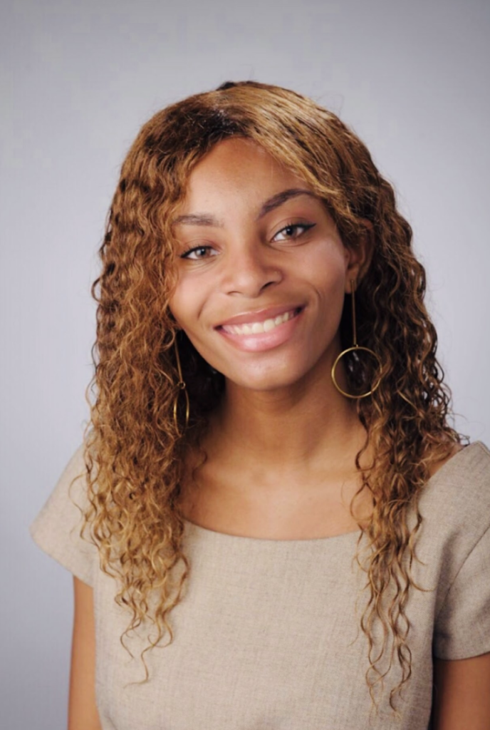young woman smiles at the camera