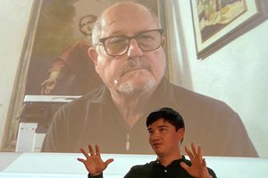 Kai Patricio speaking in front of Gianfranco Zaccai who was the funder and keynote speaker at the recent Design Led No Code Hackathon