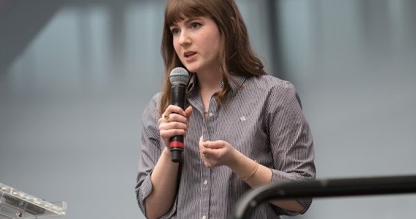 a person pitching at a competition