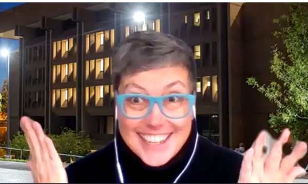 person wearing glass in front of screen shot of bird library