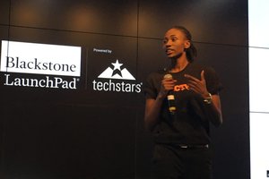 woman pitching to an audience