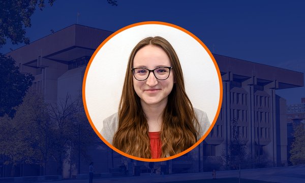 Circular portrait of Kiley Jolicoeur with orange outline over dark blue overlaid image of Bird Library
