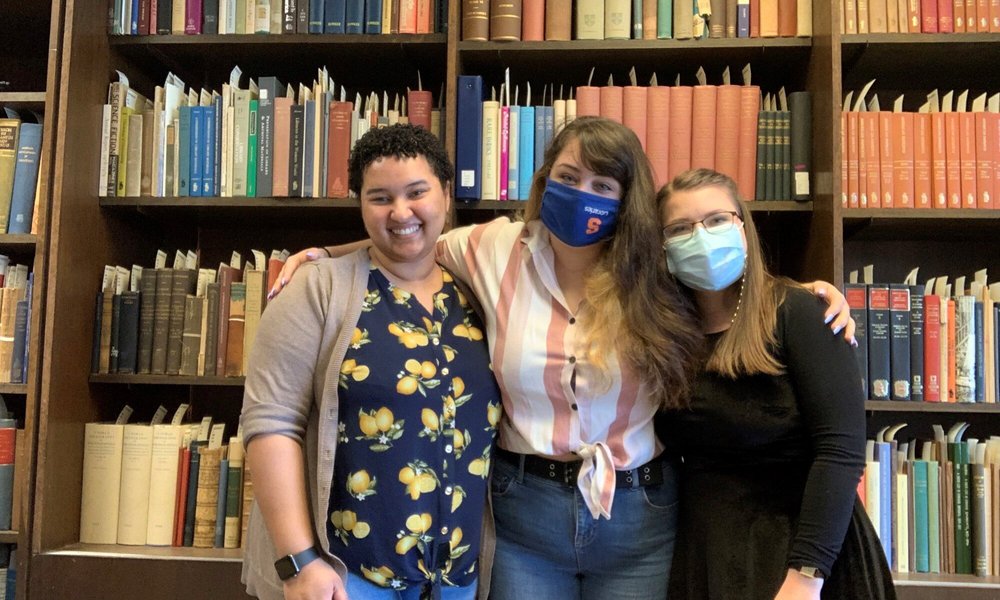 L-R: Aisha, Nora, and Tiffany in the archives