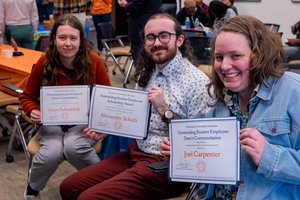 Three Libraries graduate student employees at the Student Employee Awards Celebration, Bird Library, April 20, 2026 (left to right: Grace Suhadolnik, Alexander Schulz, and Joel Carpenter).