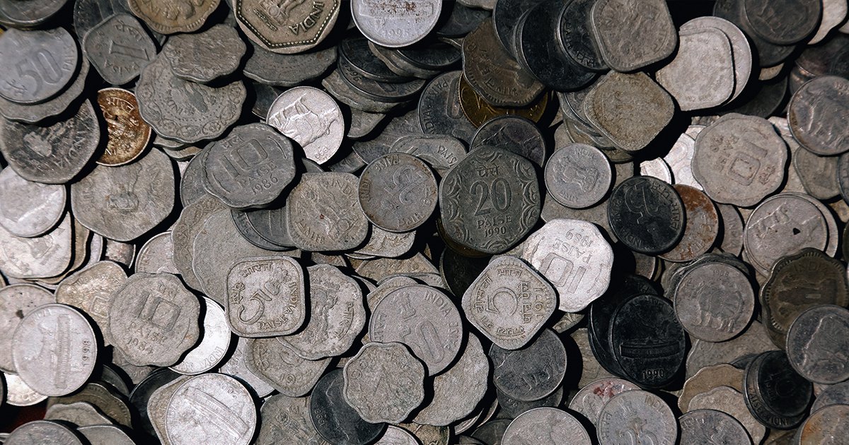 Pile of multicolored and shaped coins