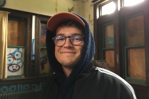 young man in a hooded sweatshirt