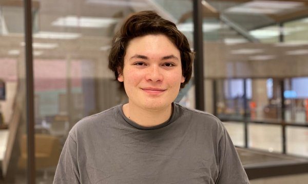 Mauricio Luna poses for a photo in Bird Library
