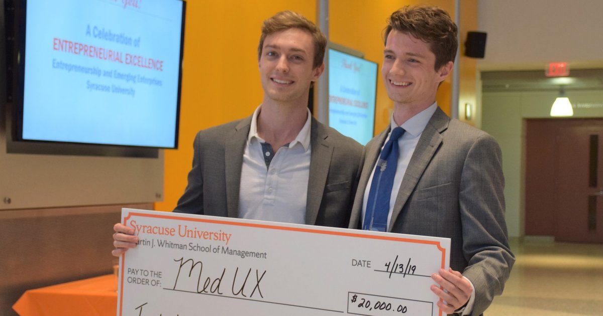 Alec and Quinn with prize check