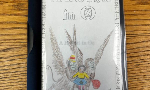 hand-written booklet with pencil drawing on cover