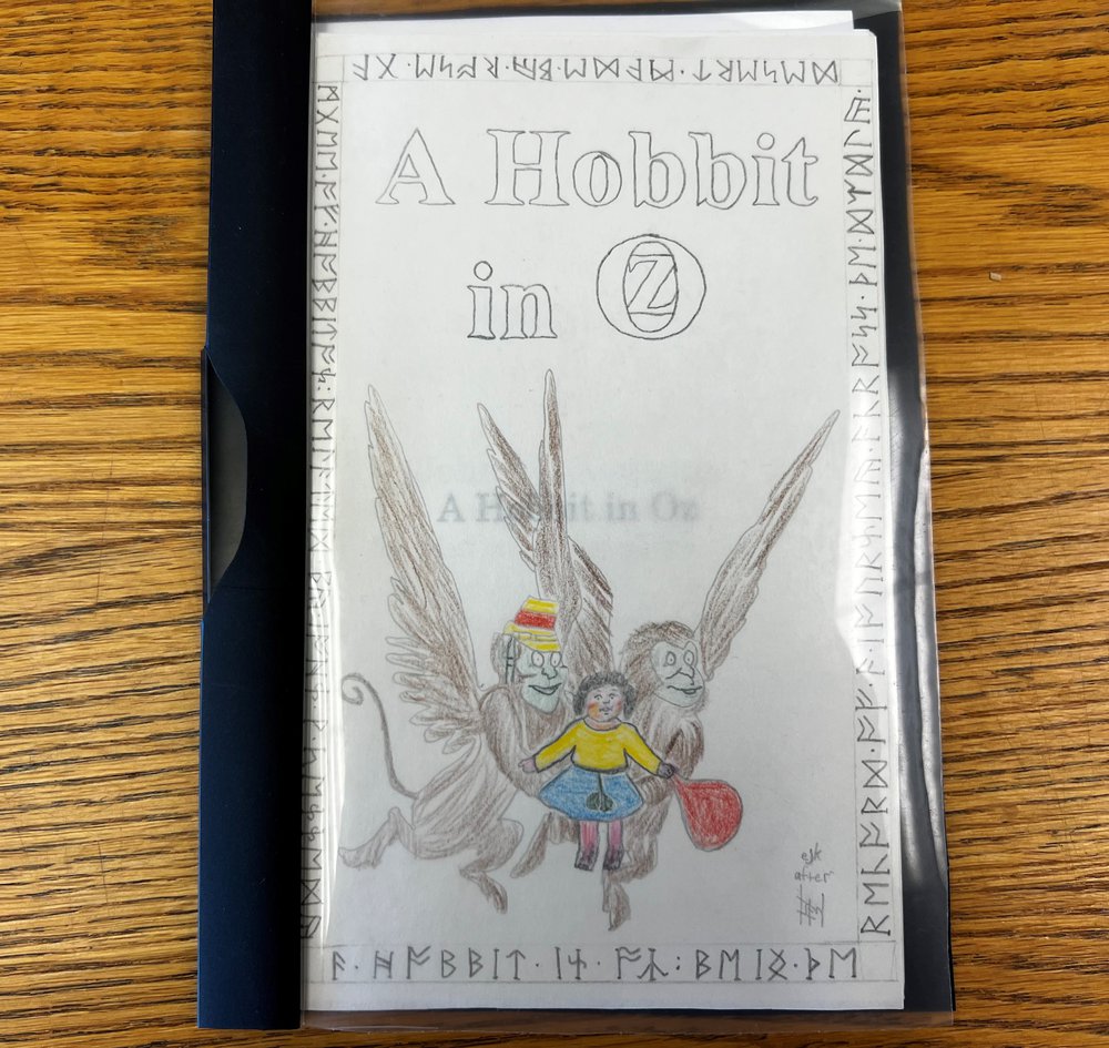 hand-written booklet with pencil drawing on cover