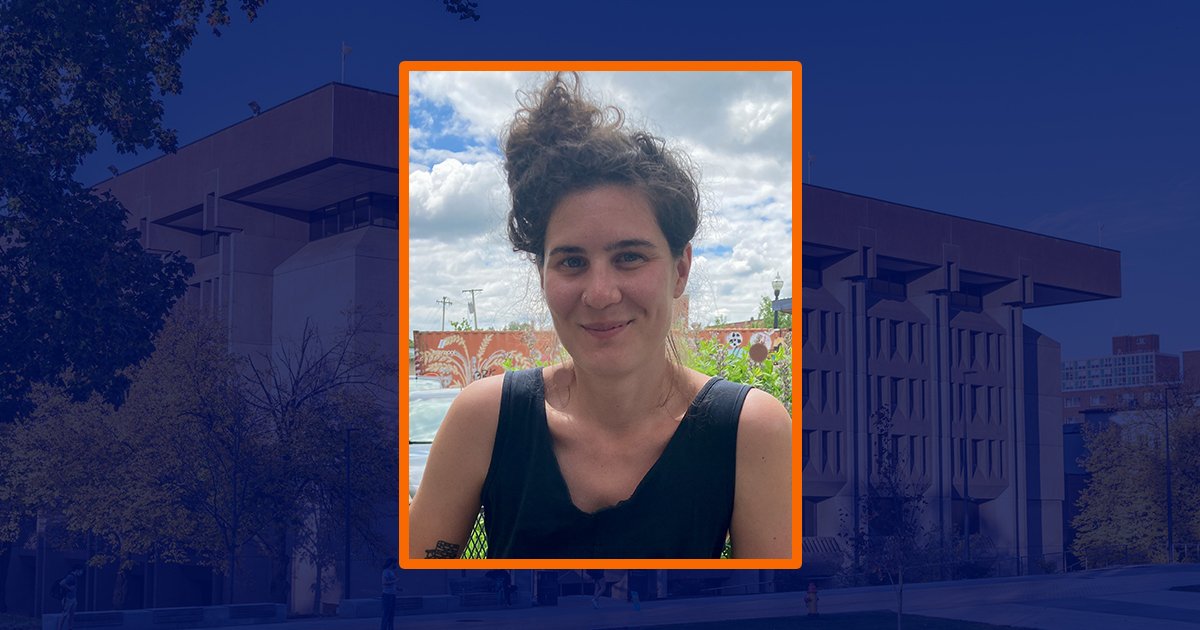 headshot of woman with blue sepia background