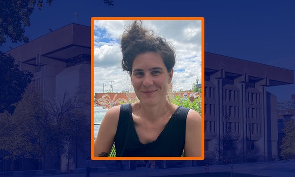 headshot of woman with blue sepia background