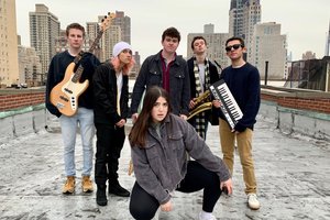 group of bandmembers on a rooftop in syracuse