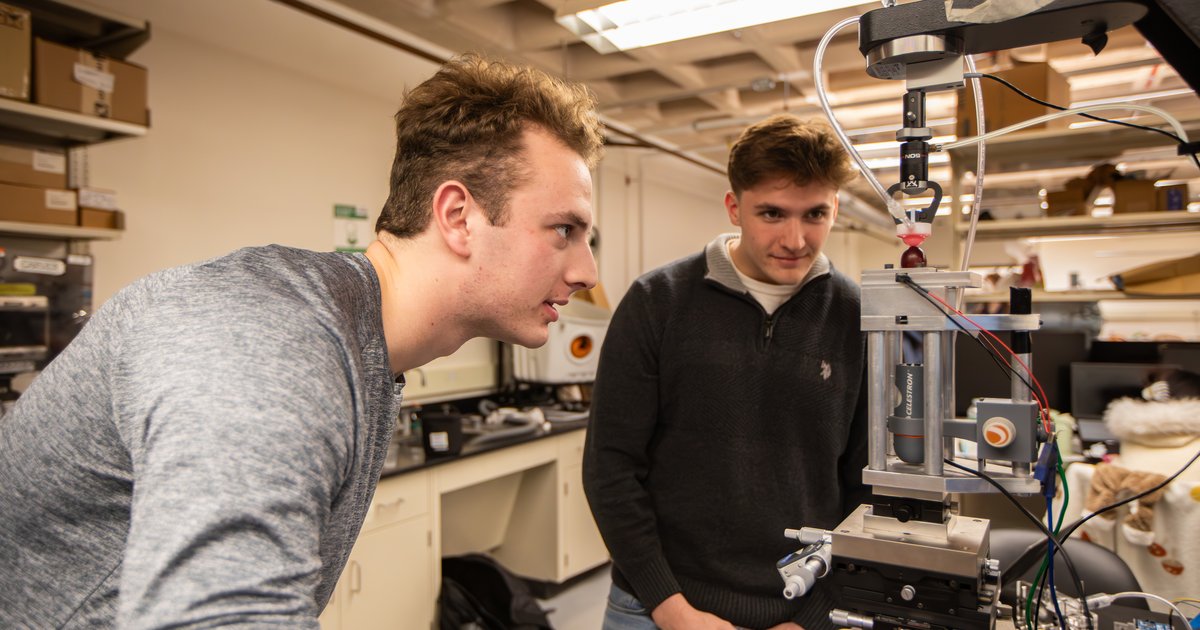 two students working in lab on technology