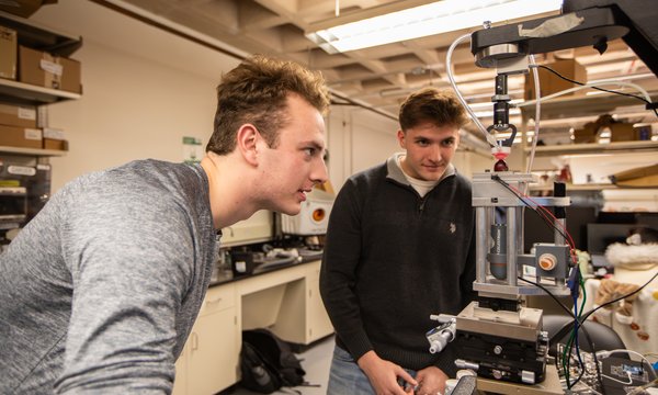 two students working in lab on technology