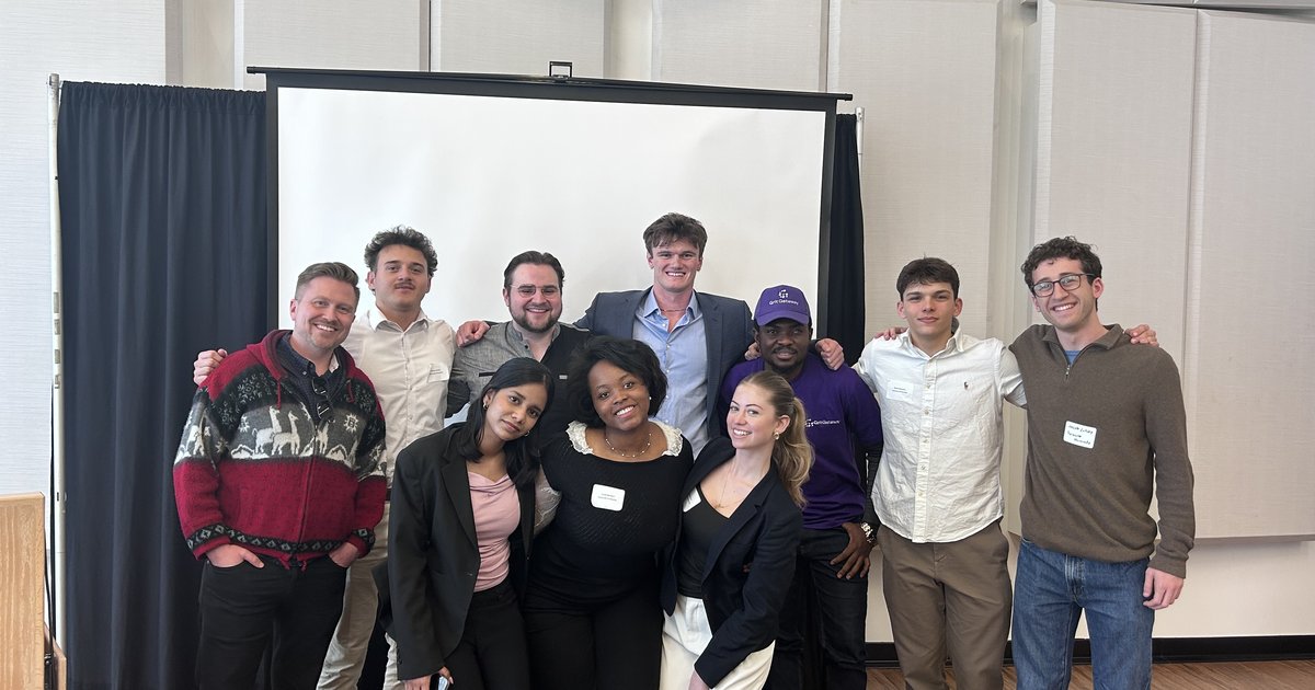 group photo of ten people posing