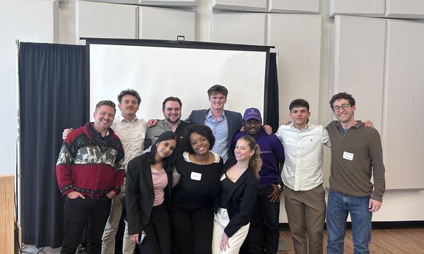 group photo of ten people posing