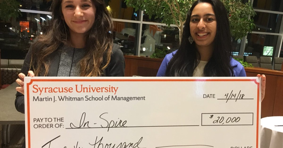 prize winners with check
