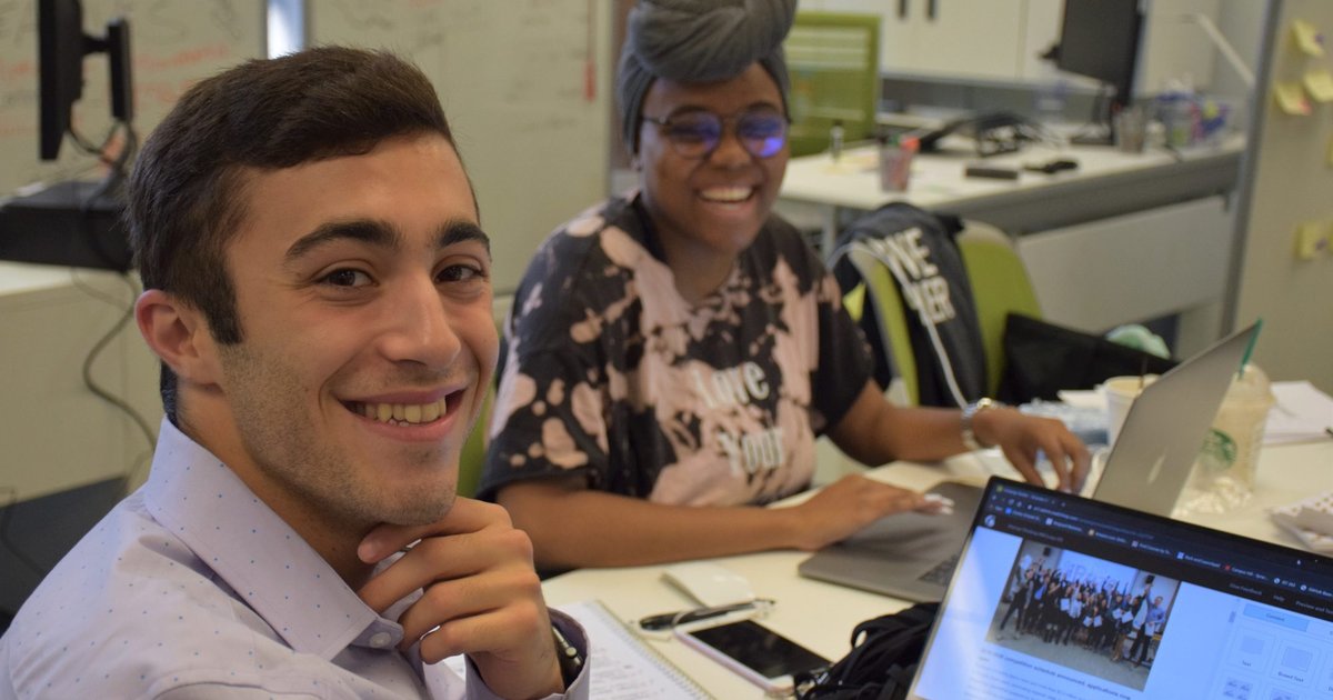 two people working at table