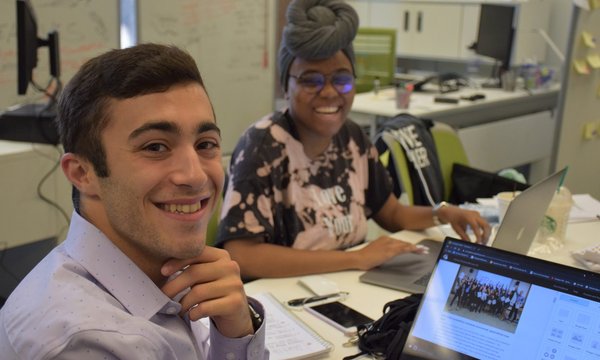 two people working at table