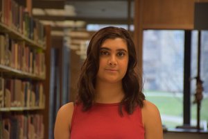 woman in library stacks