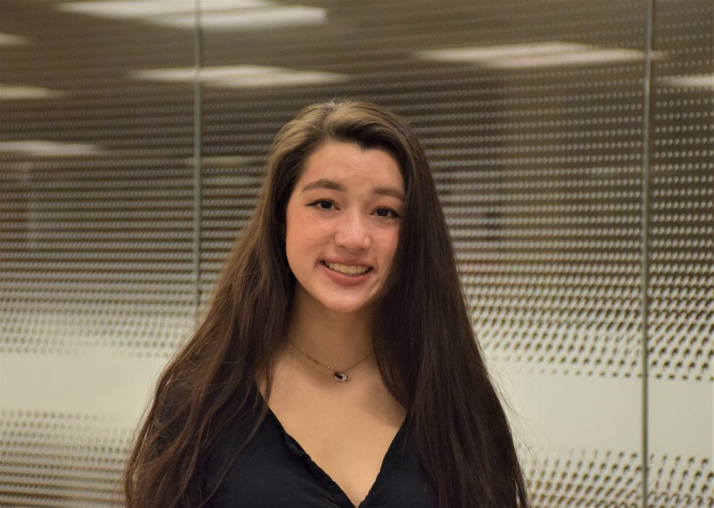 a female student smiles for a photo